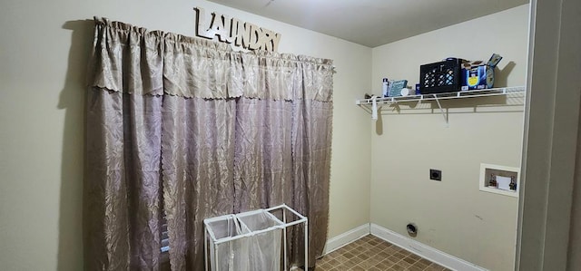 laundry room featuring baseboards, laundry area, hookup for a washing machine, and hookup for an electric dryer