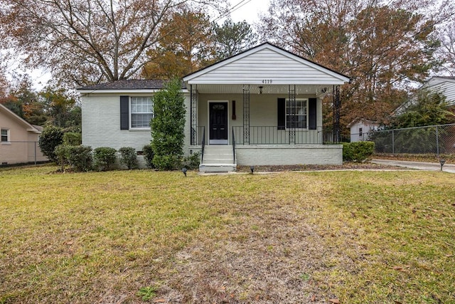 bungalow-style home with a front lawn and covered porch