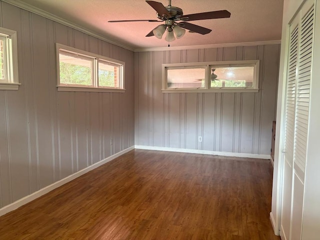 1403 Forest Dr, Columbus, GA 31907 - spare room with wood finished floors, a ceiling fan, crown molding, and a textured ceiling