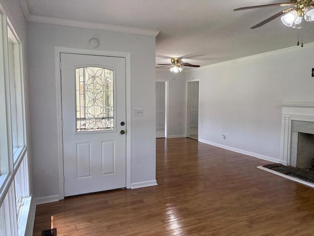 1403 Forest Dr, Columbus, GA 31907 - entrance foyer with ceiling fan, healthy amount of natural light, dark wood-style flooring, a premium fireplace, and crown molding