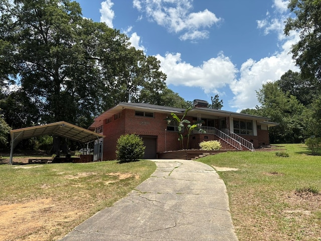 1403 Forest Dr, Columbus, GA 31907 - view of front of house featuring concrete driveway, a front yard, an attached garage, and brick siding