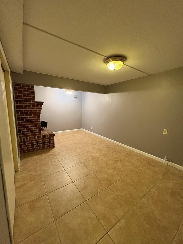 1403 Forest Dr, Columbus, GA 31907 - finished below grade area with light tile patterned floors and a fireplace