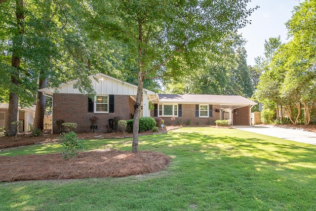 3422 Malatche Dr, Columbus, GA 31907 - ranch-style house featuring driveway, a front lawn, brick siding, a carport, and board and batten siding