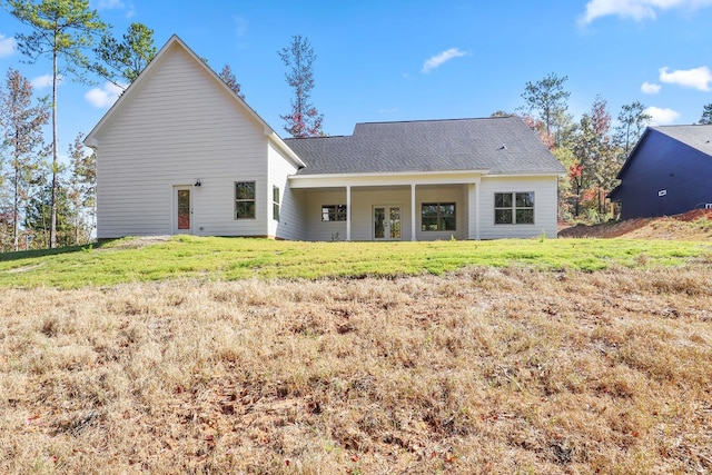 back of house with a yard