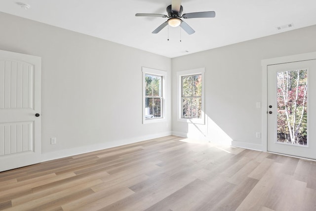 spare room featuring light wood-type flooring and ceiling fan