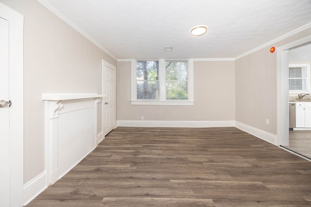 7 Magnolia St, Columbus, GA 31904 - unfurnished living room featuring dark wood-style floors and ornamental molding
