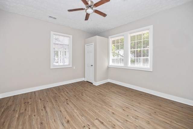 7 Magnolia St, Columbus, GA 31904 - spare room with wood finished floors, a textured ceiling, and a ceiling fan