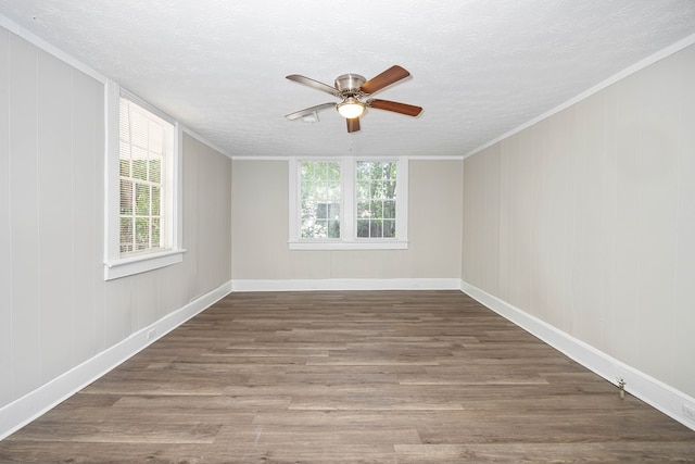 7 Magnolia St, Columbus, GA 31904 - unfurnished room featuring a ceiling fan, a textured ceiling, healthy amount of natural light, wood finished floors, and crown molding