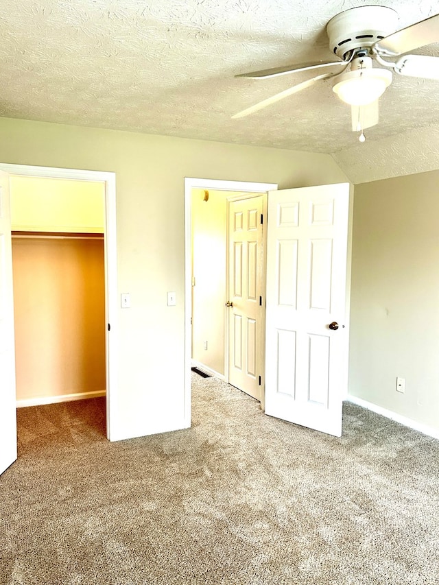 7396 Cedar Creek Loop, Columbus, GA 31904 - unfurnished bedroom featuring a spacious closet, carpet flooring, a closet, a ceiling fan, and a textured ceiling