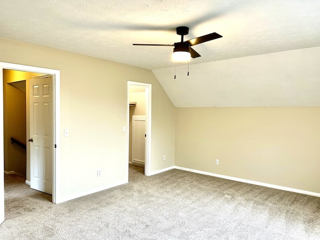 7396 Cedar Creek Loop, Columbus, GA 31904 - unfurnished bedroom featuring carpet, vaulted ceiling, a spacious closet, baseboards, and ceiling fan