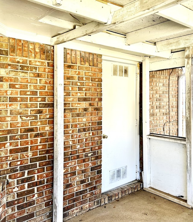 property entrance featuring visible vents