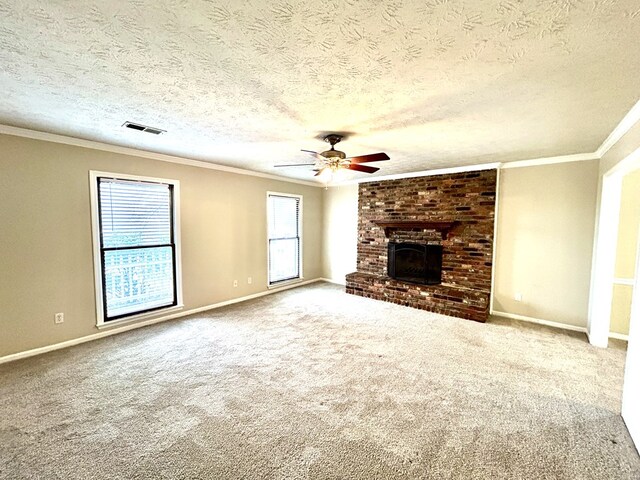 7396 Cedar Creek Loop, Columbus, GA 31904 - unfurnished living room featuring a ceiling fan, crown molding, baseboards, carpet floors, and a fireplace