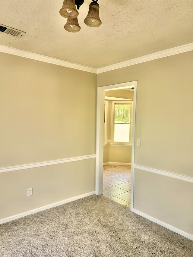 7396 Cedar Creek Loop, Columbus, GA 31904 - empty room with light colored carpet, crown molding, baseboards, a textured ceiling, and light tile patterned floors