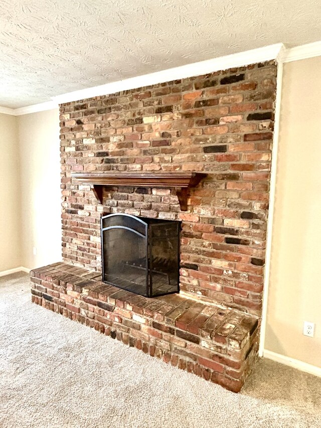 7396 Cedar Creek Loop, Columbus, GA 31904 - detailed view of carpet floors, crown molding, a brick fireplace, a textured ceiling, and baseboards