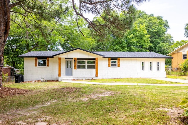 ranch-style home with brick siding, crawl space, and roof with shingles