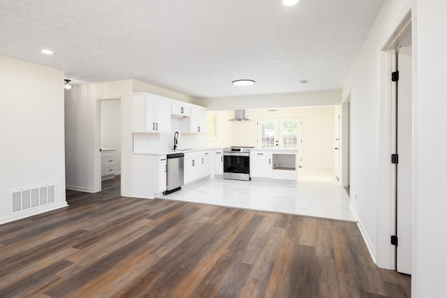 754 Wright Dr, Columbus, GA 31907 - kitchen featuring stainless steel appliances, wall chimney range hood, wood finished floors, light countertops, and recessed lighting