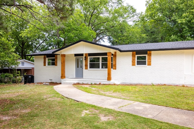 754 Wright Dr, Columbus, GA 31907 - view of front facade featuring brick siding, covered porch, a front yard, and crawl space
