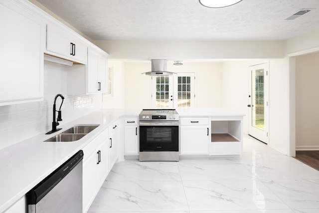754 Wright Dr, Columbus, GA 31907 - kitchen featuring stainless steel appliances, island exhaust hood, light countertops, white cabinetry, and a textured ceiling