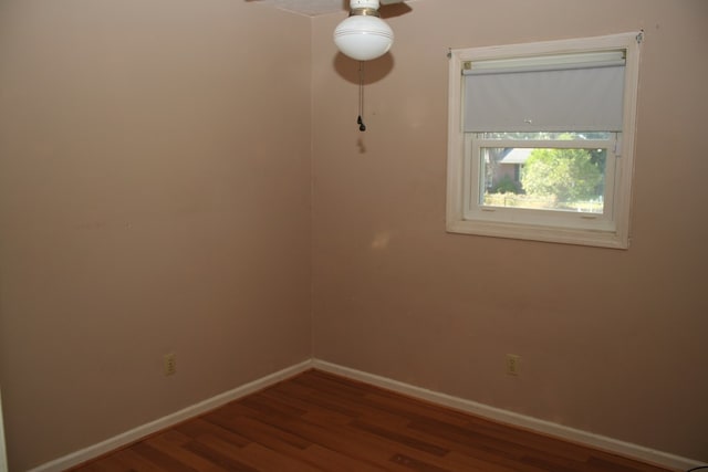 spare room with hardwood / wood-style flooring