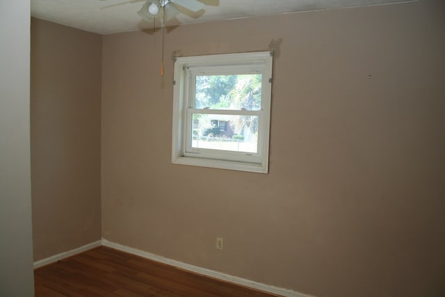 unfurnished room featuring ceiling fan and dark hardwood / wood-style floors