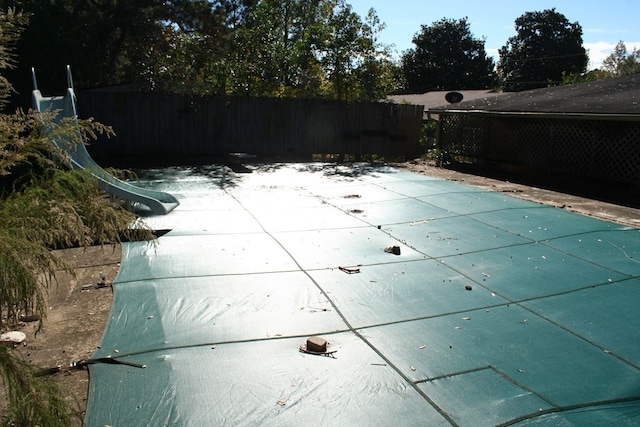 view of pool with a water slide