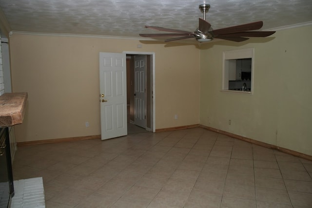 unfurnished living room with a textured ceiling, crown molding, and light tile patterned flooring