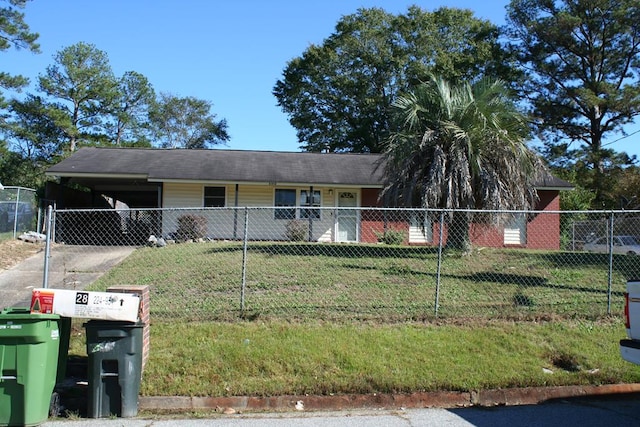 ranch-style home with a carport and a front yard