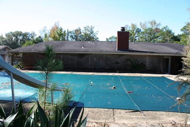 view of pool with a water slide