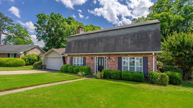 438 Newport Pl, Columbus, GA 31904 - dutch colonial featuring brick siding, concrete driveway, a front lawn, and an attached garage