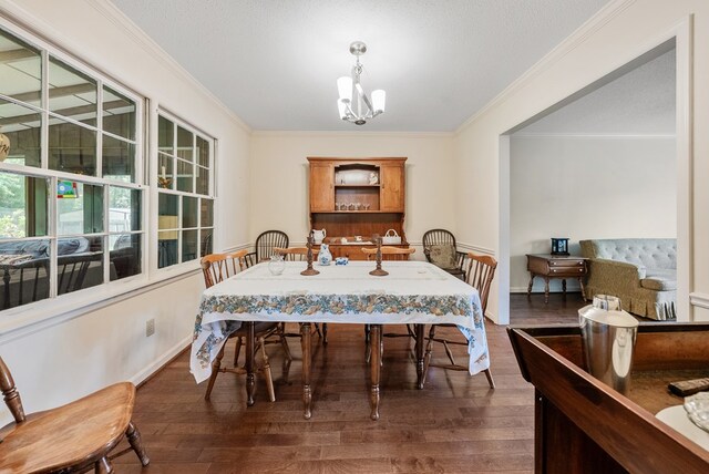 438 Newport Pl, Columbus, GA 31904 - dining space featuring a chandelier, wood finished floors, crown molding, and baseboards