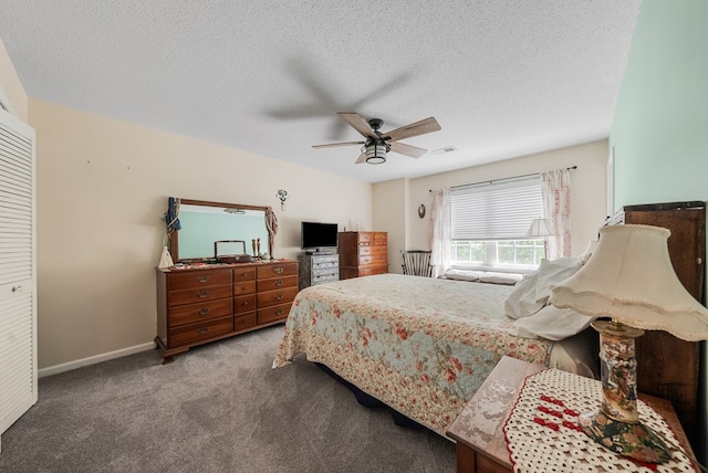 438 Newport Pl, Columbus, GA 31904 - carpeted bedroom featuring a textured ceiling, a ceiling fan, and baseboards