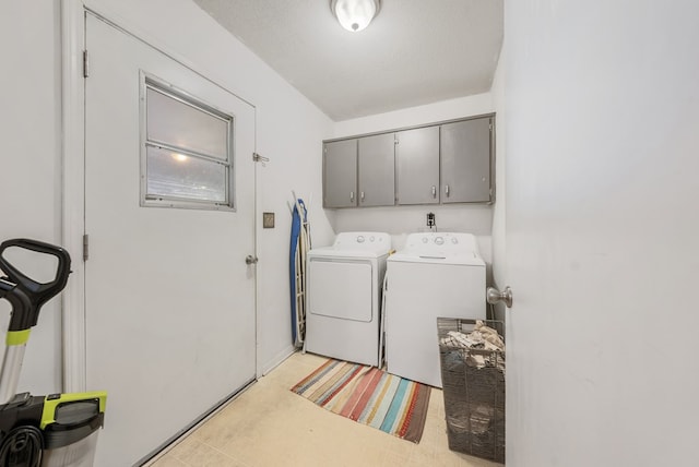 438 Newport Pl, Columbus, GA 31904 - laundry room with cabinet space, independent washer and dryer, and light floors