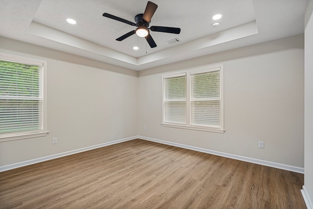 1712 39th St, Phenix City, AL 36867 - spare room featuring a raised ceiling, wood finished floors, recessed lighting, a ceiling fan, and a smoke detector