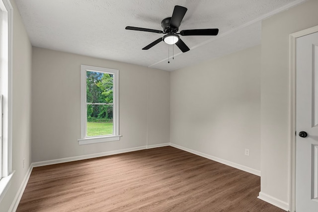 1712 39th St, Phenix City, AL 36867 - unfurnished room featuring wood finished floors, a textured ceiling, and ceiling fan
