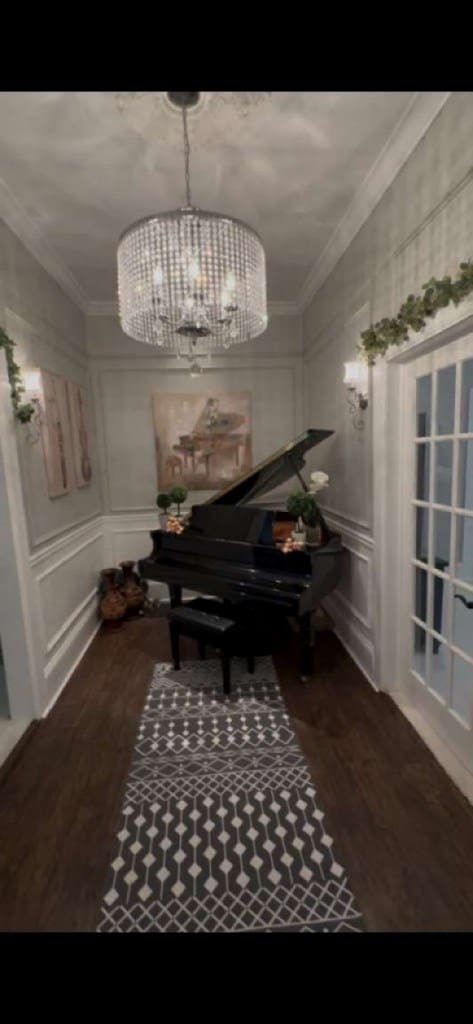 1314 Talbotton Rd, Columbus, GA 31901 - sitting room with a decorative wall, wood finished floors, a chandelier, and crown molding