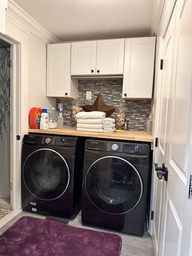 1314 Talbotton Rd, Columbus, GA 31901 - laundry room with washing machine and clothes dryer, cabinet space, and ornamental molding