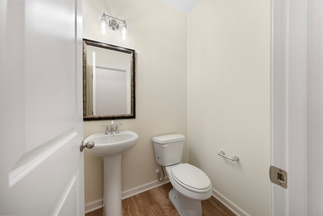 2276 Webbed Way, Opelika, AL 36804 - half bathroom featuring wood finished floors and toilet