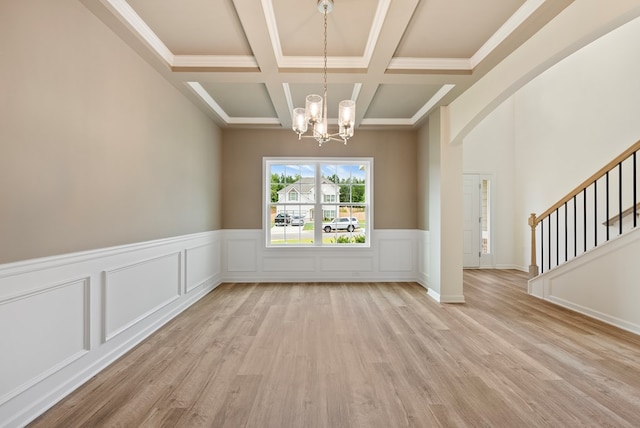 2276 Webbed Way, Opelika, AL 36804 - unfurnished dining area featuring a chandelier, coffered ceiling, wood finished floors, beamed ceiling, and stairway