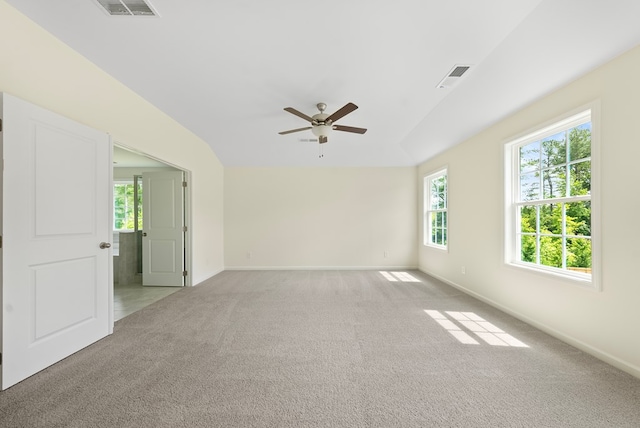 2276 Webbed Way, Opelika, AL 36804 - spare room featuring vaulted ceiling, ceiling fan, healthy amount of natural light, and light colored carpet