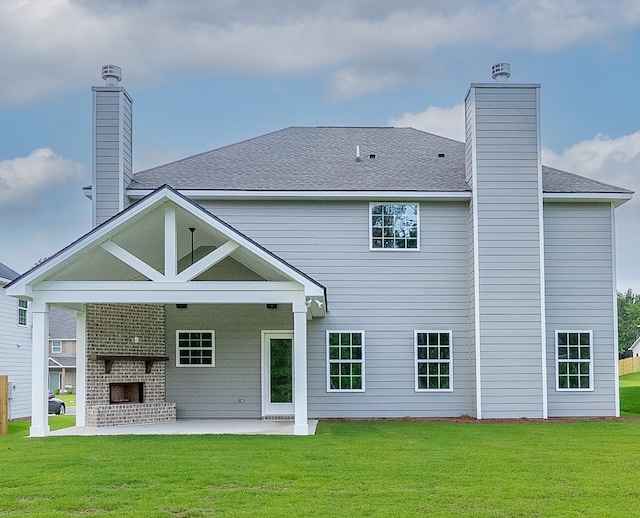2276 Webbed Way, Opelika, AL 36804 - back of property featuring a chimney, a patio, a yard, and a shingled roof