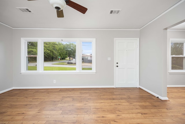 1402 41st St, Columbus, GA 31904 - empty room with crown molding, light wood-style floors, a ceiling fan, and baseboards