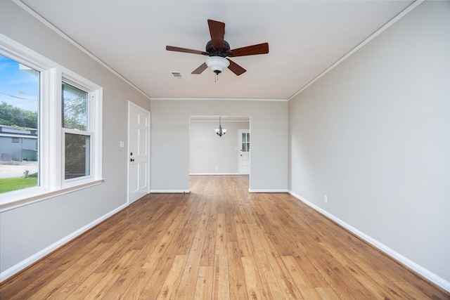 1402 41st St, Columbus, GA 31904 - spare room featuring a chandelier, light wood-style flooring, ornamental molding, and baseboards