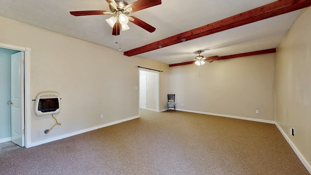 carpeted empty room with heating unit, a ceiling fan, baseboards, a barn door, and beamed ceiling