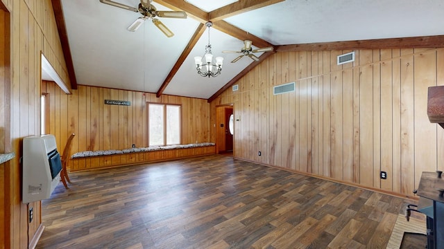 unfurnished living room featuring heating unit, visible vents, vaulted ceiling with beams, and wood finished floors