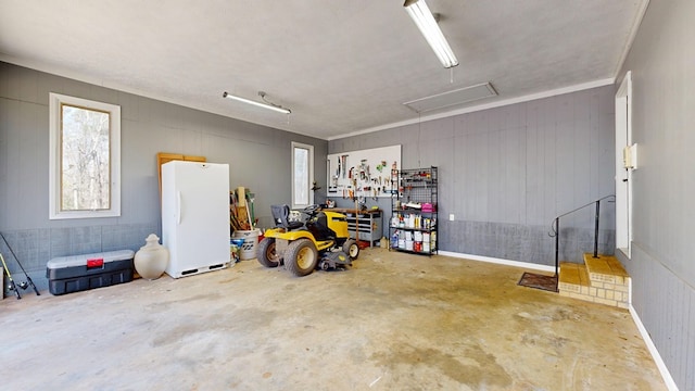 garage with freestanding refrigerator