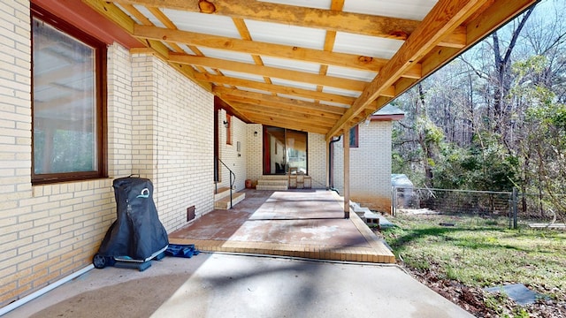 view of patio featuring fence