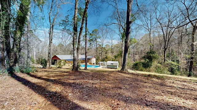 view of yard with a forest view