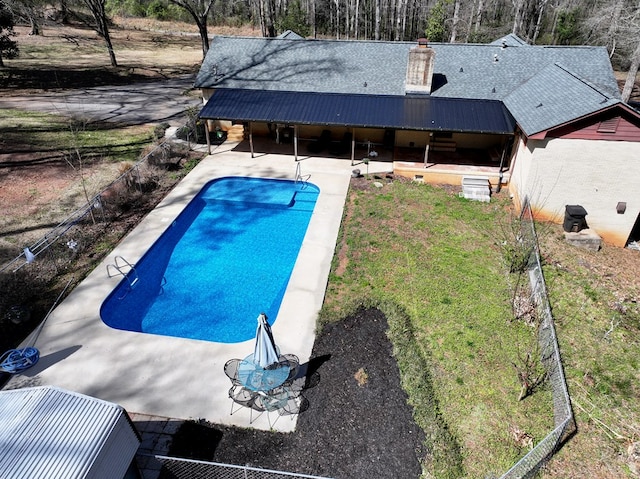 pool featuring a patio and fence