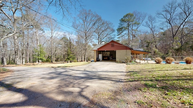 exterior space with a wooded view and fence