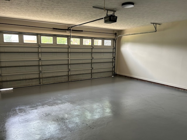 garage featuring baseboards and a garage door opener